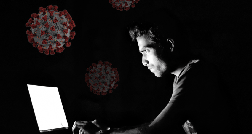 person on computer, corona virus in the background